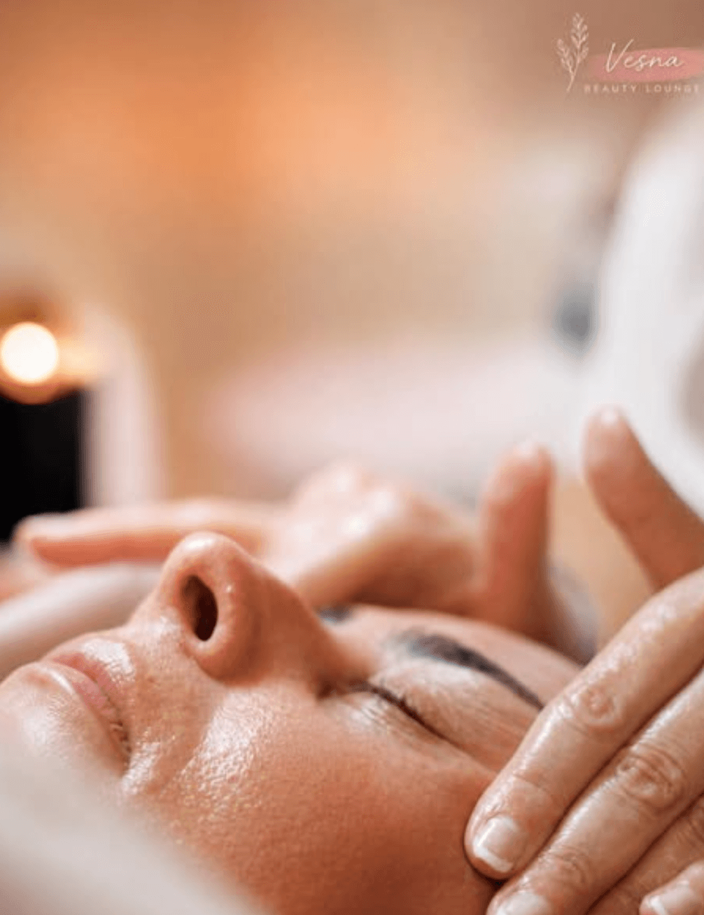Close-up of a client's face during a gentle facial massage.